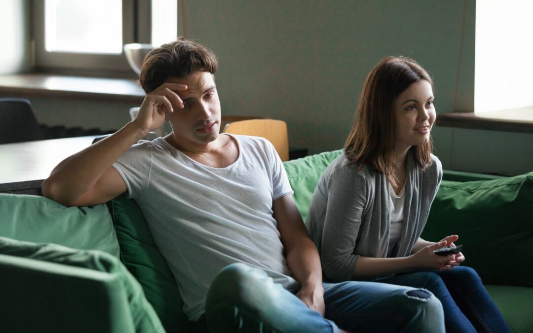Disinterested boyfriend getting bored while excited girlfriend w